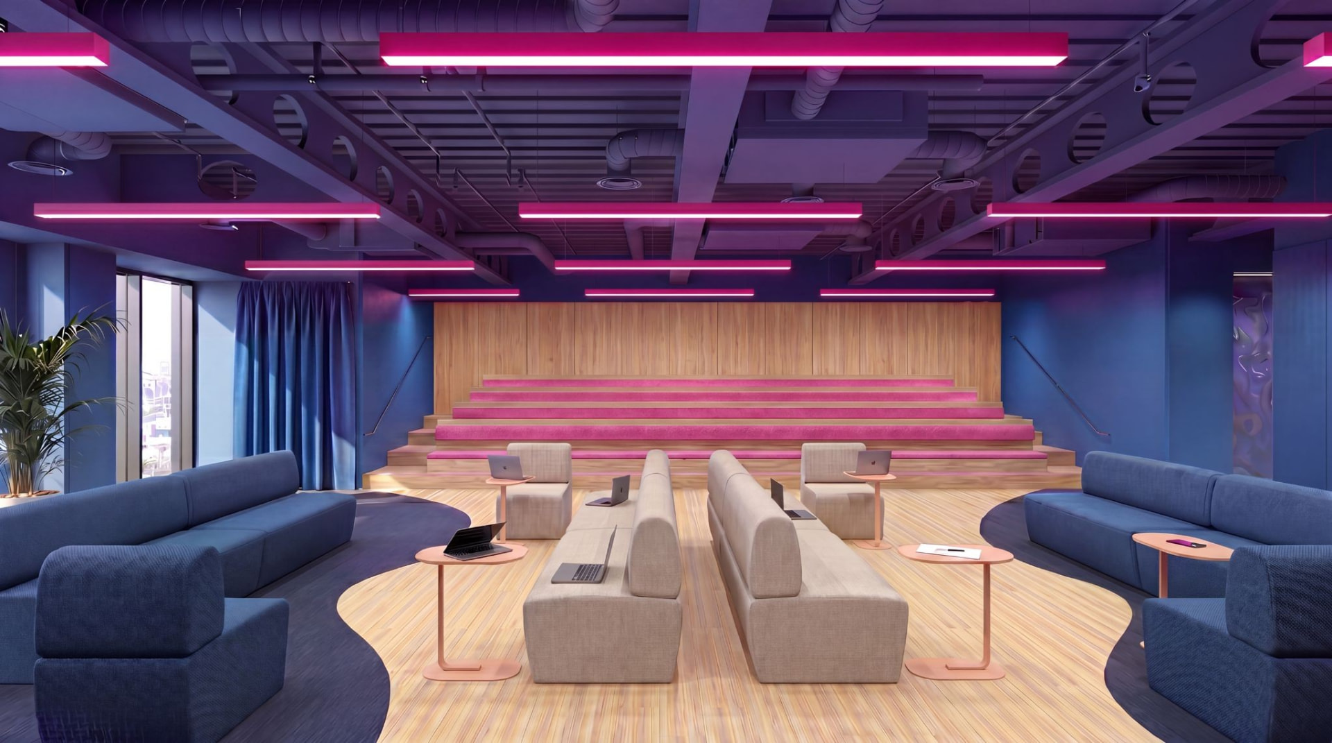 Tiered theatre space with pink lighting in the Experience Lab